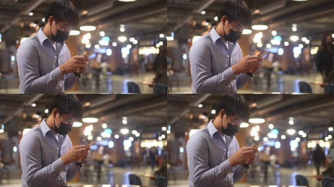 亚洲男子使用智能手机