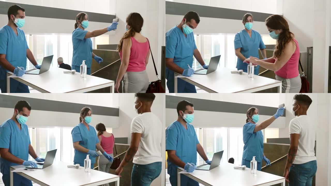 在医院门口接受检查的人群的实时视频，以了解新型冠状病毒肺炎控制措施