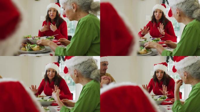快乐的高加索成年女儿在圣诞大餐中与母亲交谈