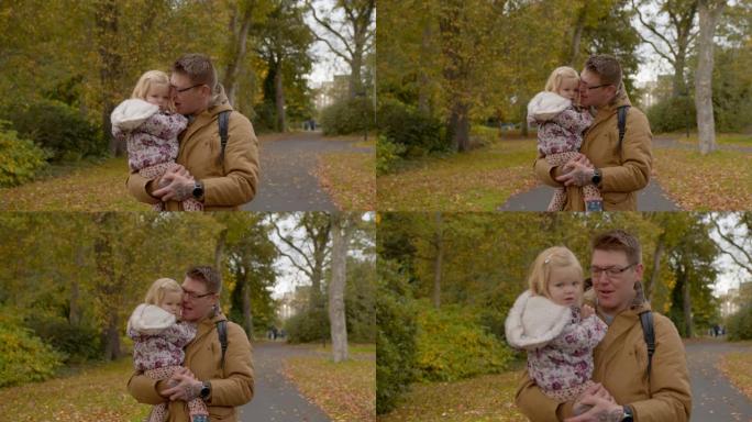 抱着我女儿小女孩父亲公园