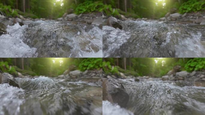 慢动作拍摄森林中汹涌的山河。山川清水的万向镜头在石头之间流动