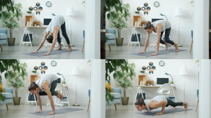 一个人在公寓里独自做复杂的瑜伽体式训练的慢动作