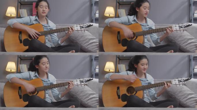 快乐的少女在家客厅弹吉他，创意爱好