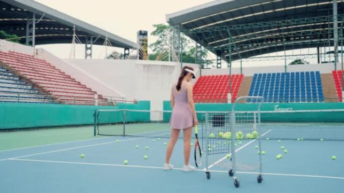 亚洲年轻女子打网球身体健康。