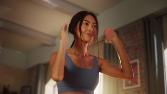 家庭健身房训练: 美丽健康的亚洲女性做有氧运动。强壮的超级女运动员锻炼身体。精力充沛的行动、健身、汗
