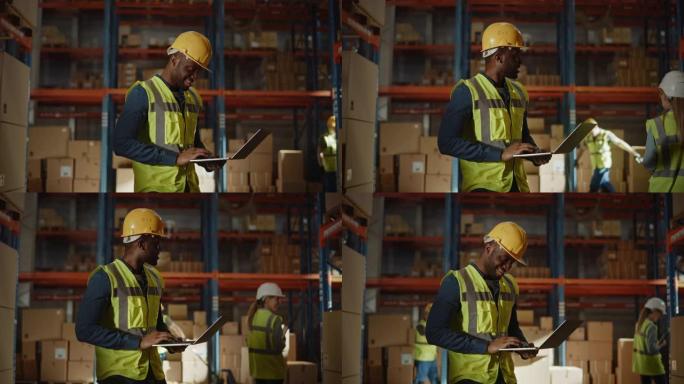 专业的男性工人戴着安全帽，拿着笔记本电脑在零售仓库里检查库存和库存，仓库里摆满了货物和工作人员。侧视
