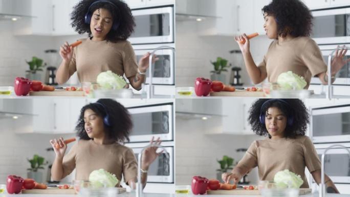 4k视频片段，一名年轻女子在家中使用耳机并做健康的饭菜