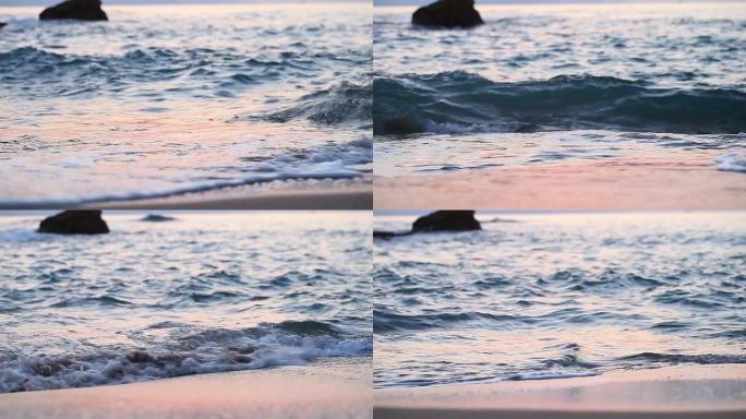 日出时海滩上的海浪