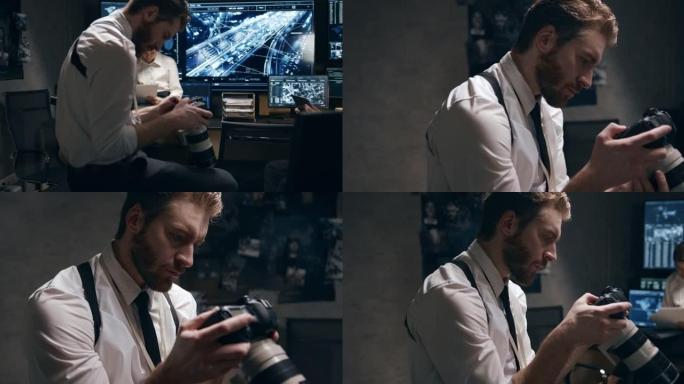 情报中心的一名男子在数码相机上浏览照片。