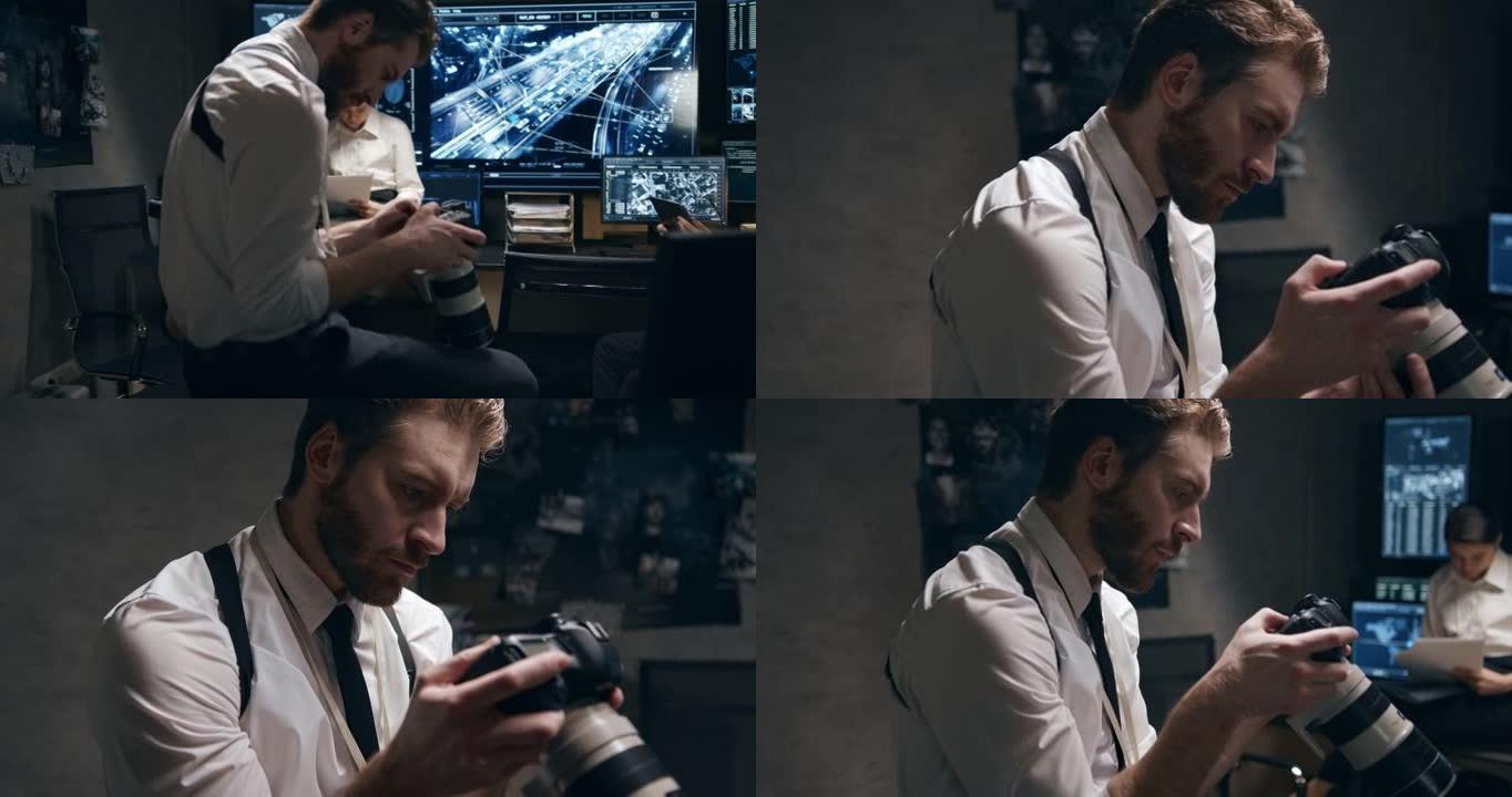 情报中心的一名男子在数码相机上浏览照片。