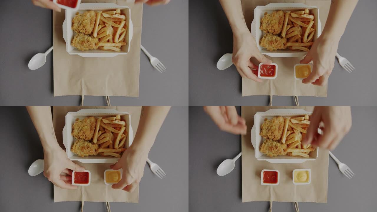创意平放美味的食物装在纸袋上的容器里，女性双手送餐