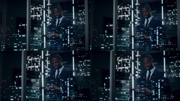 时尚的黑人商人使用笔记本电脑的肖像，夜城在窗户上反射。成功的非洲裔美国首席执行官在计算机上打字，工作