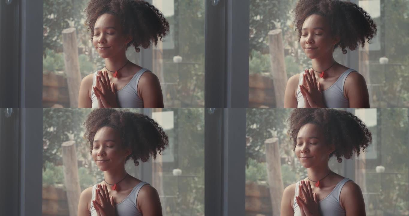 4k视频片段，一名年轻女子在瑜伽课上冥想