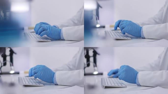 医生，手和手套在键盘上打字，用于研究，医疗数据或在办公桌上的计算机上浏览。在PC上从事在线科学发现的