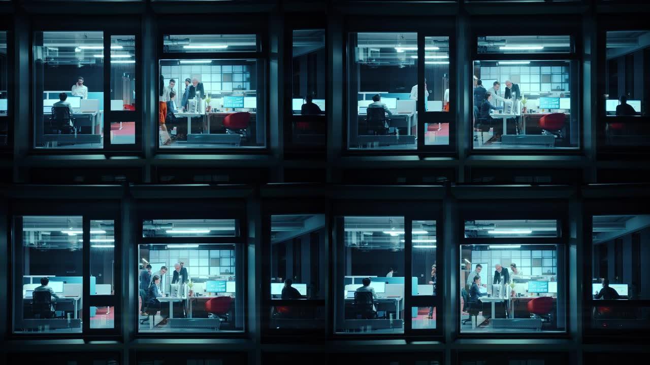 窗外的镜头: 在办公室工作的商人和女商人。经理在晚上做金融业务。员工在电脑、笔记本电脑、手机、平板电