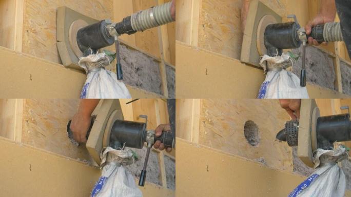 特写: Builder使用鼓风机用再生纸隔离木墙。