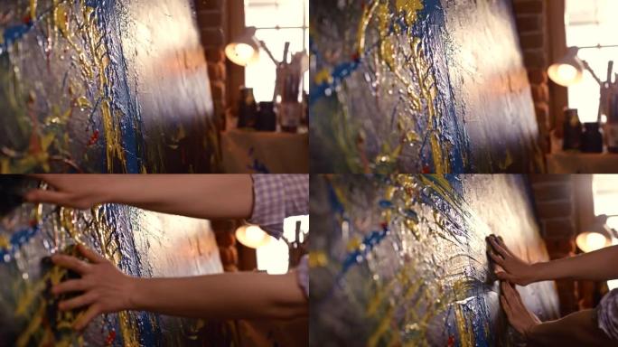 超级SLO MO无法识别的艺术家用手在画布上绘画