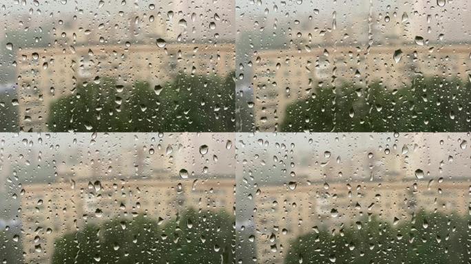 大雨。在大风雷雨中，雨滴从窗玻璃上滚下来。特写镜头，4K