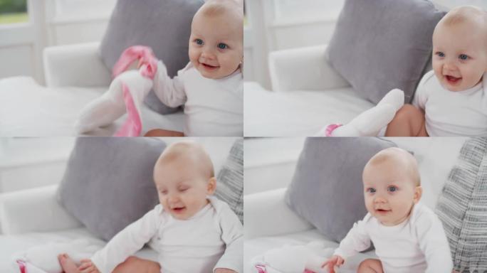 肖像快乐的婴儿与美丽的蓝眼睛看起来好奇的蹒跚学步微笑享受生活健康的婴儿在家4k