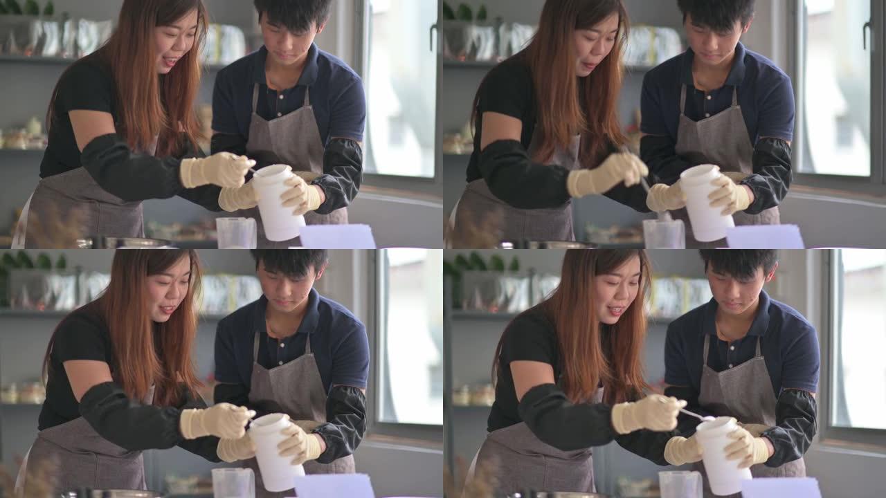 亚洲中国十几岁的男孩从女艺术家那里学习肥皂制作过程