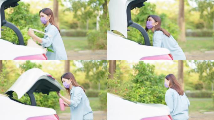 女人把包放在行李箱里