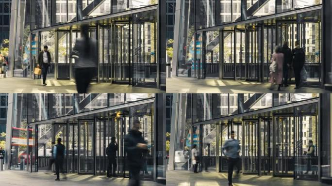 伦敦市区商务人士通过自动旋转门进出办公楼的时间流逝