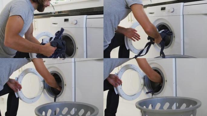 白人男子在家里的洗衣机里放围裙