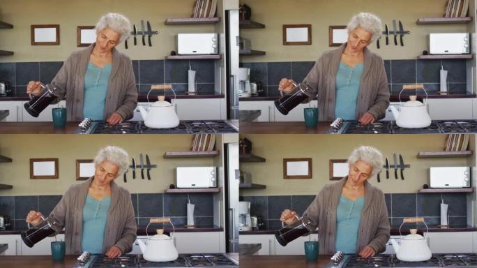 高级混血妇女在厨房准备咖啡的肖像