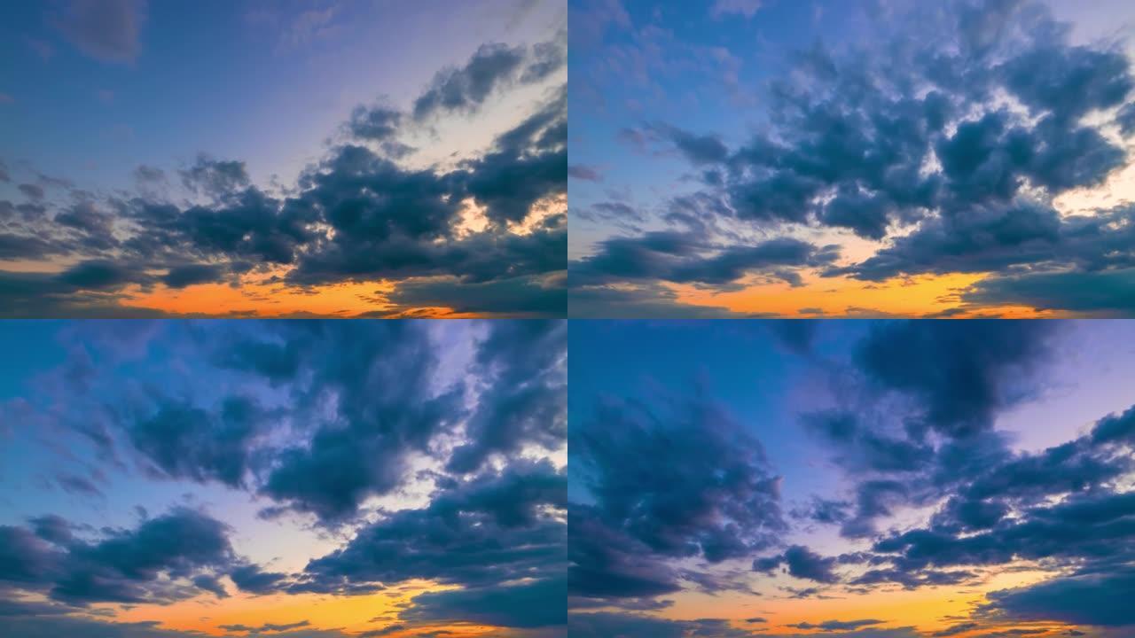 延时日出的天空，前面有很多深蓝色的积云，从后到前移动
