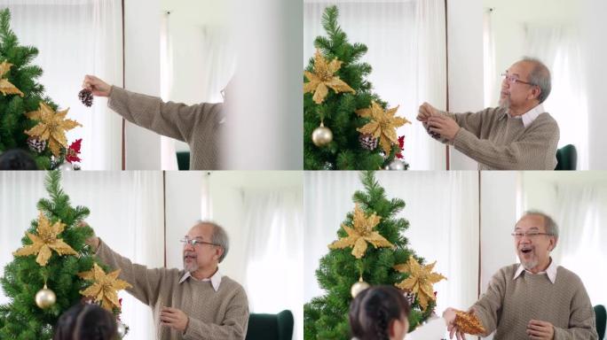 4K UHD手持多莉拍摄快乐的亚洲女孩和她的祖父多代家庭装饰圣诞树与装饰品一起准备快乐的节日冬天。