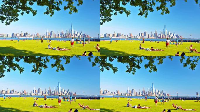 新泽西州曼哈顿市中心。公共公园。绿色草坪。闲暇的人。日光浴。树。
