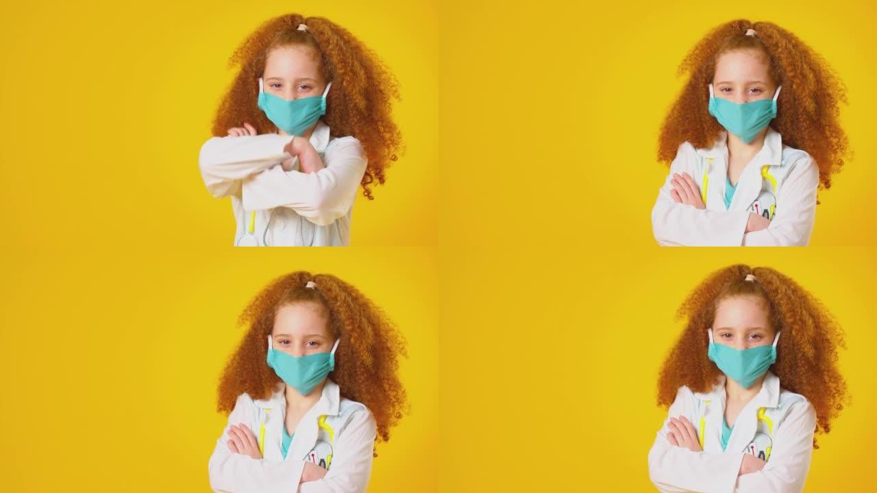 演播室拍摄的女孩打扮成医生或外科医生，戴着口罩和白色外套，听诊器在黄色背景下拍摄-慢动作拍摄