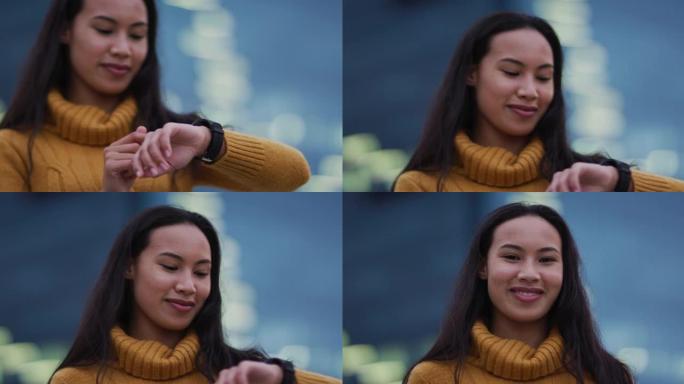 亚洲女性使用智能手表和微笑
