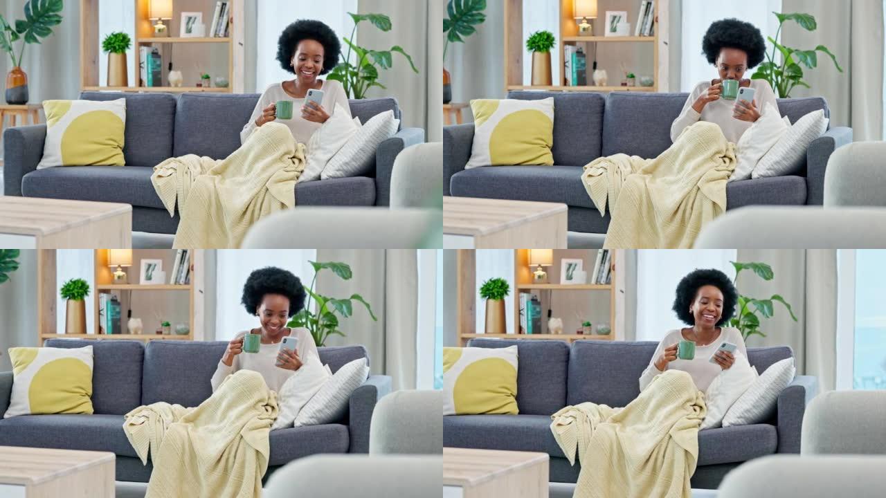 快乐的女人在家里的沙发上喝咖啡时，通过电话阅读社交媒体新闻。年轻的非洲裔美国女性发短信并在互联网上分