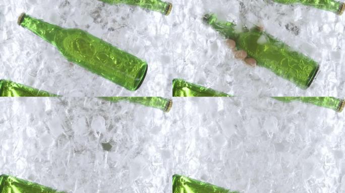 一个男人的手从冰柜中拉出啤酒瓶的特写镜头