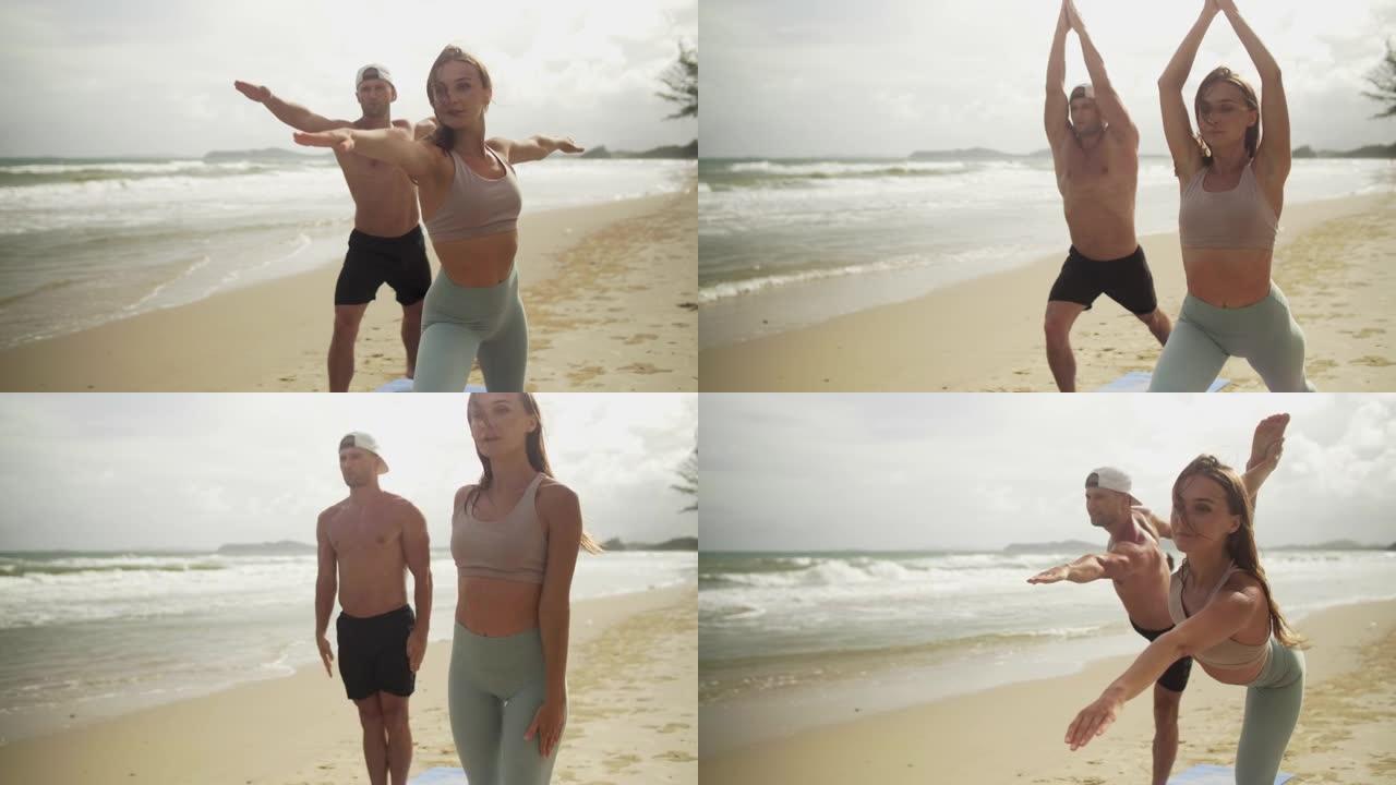夫妇喜欢在海滩上练习户外瑜伽
