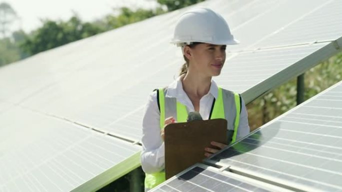 女电工检查太阳能电池板的4k录像