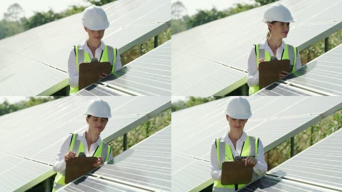 女电工检查太阳能电池板的4k录像
