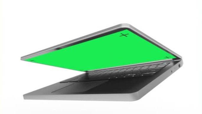 白色背景上绿色屏幕的银色笔记本电脑