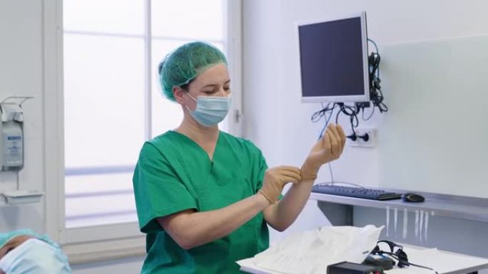 眼科医生在手术前戴上橡胶手套
