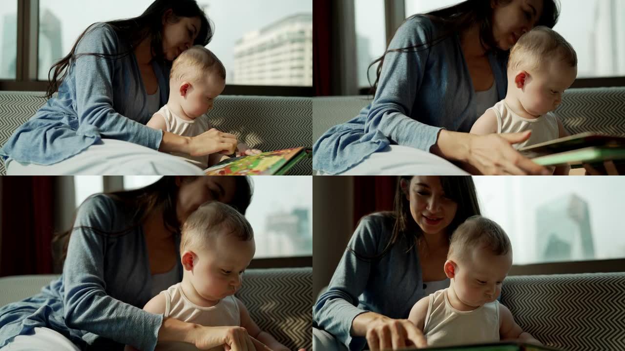一位母亲晚上坐在家里的沙发上给孩子读一个故事。单身母亲或母亲对孩子的爱。