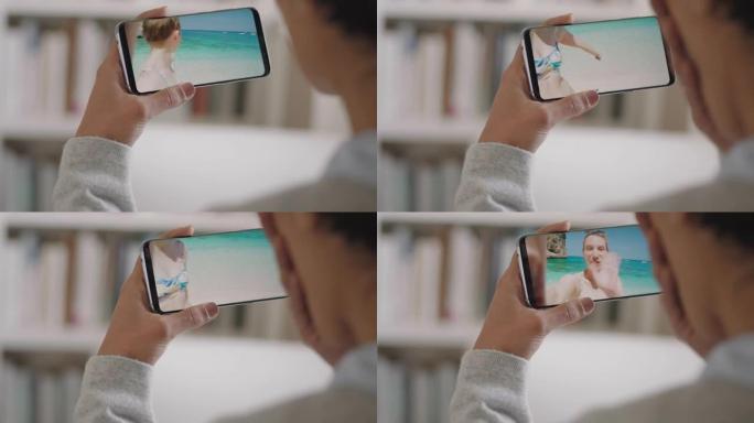年轻女子在意大利度假海滩上使用智能手机视频聊天快乐朋友分享旅游体验度假乐趣与手机交流4k镜头