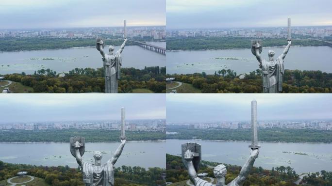 在美丽的第聂伯河上观看美丽的夏季基辅城市全景的祖国雕像的电影航拍。