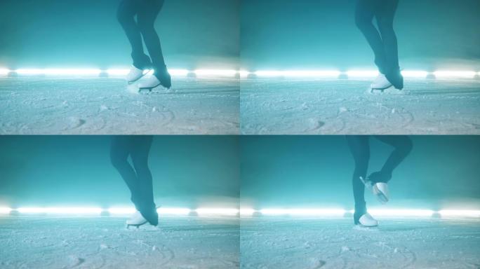 冰面上有运动员腿的冰鞋在上面旋转