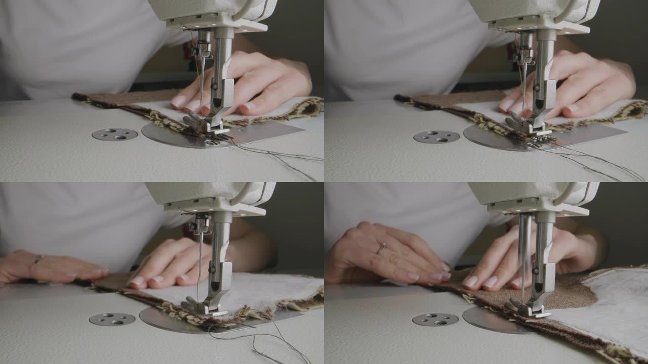 裁缝师在工作室的缝纫机上工作
