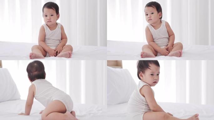 亚洲男婴年龄9个月在卧室里。东南亚和东亚: 亚洲婴儿
