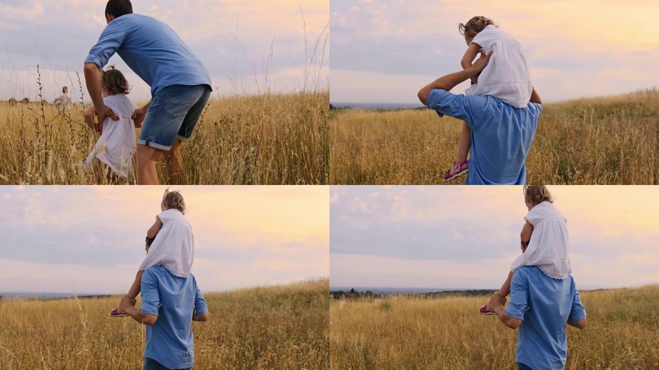 慢动作跟踪拍摄的父亲在金色草地上抱着女儿的肩膀