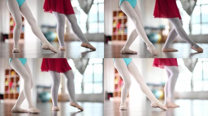 亚洲中国少女芭蕾舞演员的低段在工作室训练她的年轻女学生