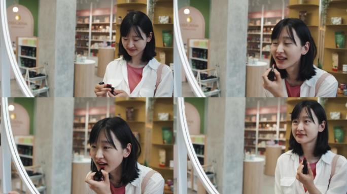 亚洲女孩在镜子前测试新的Beautycare产品