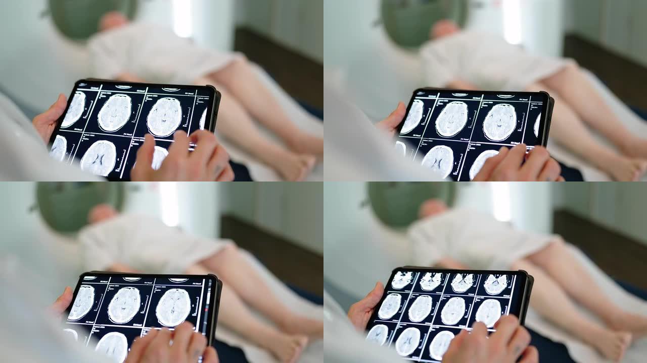 医生在诊所的数字桌子上检查患者的MRI扫描图像的特写